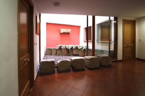 a living room filled with furniture and a doorway at Casa 1340 in Mora de Rubielos