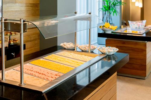 a buffet line with various types of food at Lagune Barra Hotel in Rio de Janeiro