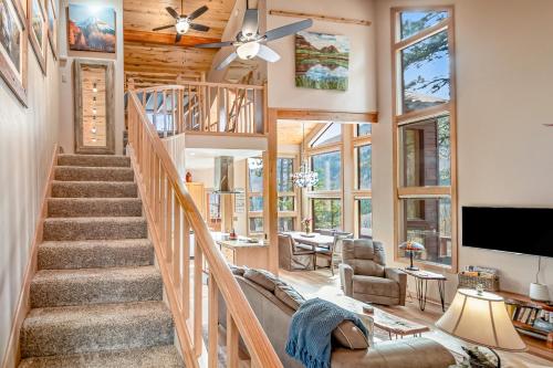 a living room with a staircase and a living room with a ceiling fan at Top of the Mesa in Durango