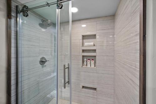 a shower stall with a glass door in a bathroom at Corinthian Circle - Dillon in Dillon