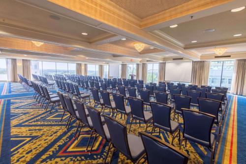a large room with chairs and a screen in it at Drury Plaza St. Louis at the Arch in Saint Louis