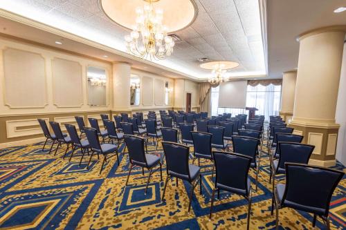 a large room with chairs and a chandelier at Drury Plaza St. Louis at the Arch in Saint Louis