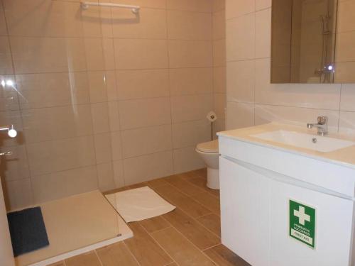 a bathroom with a shower and a sink and a toilet at CascaiSintra Holiday in Alcabideche