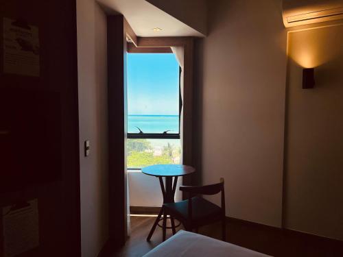 Una cama o camas en una habitación de ibis Styles Maceió Pajuçara