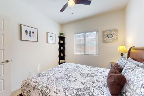 a bedroom with a bed and a ceiling fan at Golden Marigold Sanctuary in Buckeye