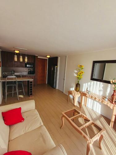 a living room with a couch and a table at Departamento Central in Calama