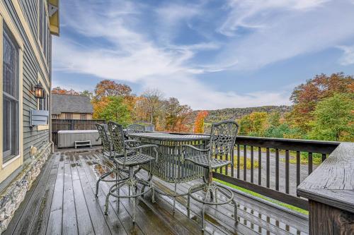 a balcony with a table and chairs on a deck at Relaxation Ridge in Oakland