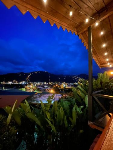 a view from the patio at night at Dreams Lodge Orosi in Cartago