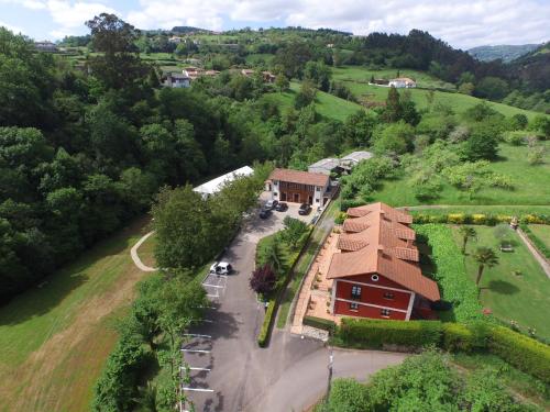 an aerial view of a house in a field at El Molín de Petra in Valbucar