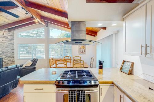 a kitchen with a stove top oven in a room at Red Umbrella Hideaway in Groveland