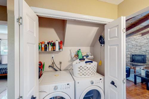 a laundry room with a washer and dryer at Red Umbrella Hideaway in Groveland