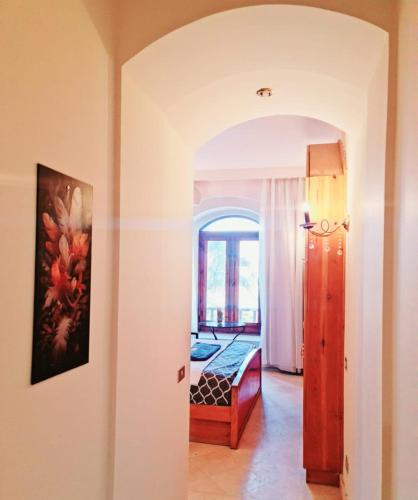 a room with a bedroom with a bed and a window at West golf 2bedroom in Hurghada
