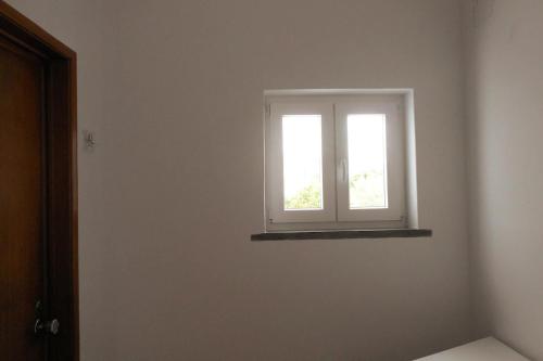 a window in the corner of a room at CascaiSintra Holiday in Alcabideche
