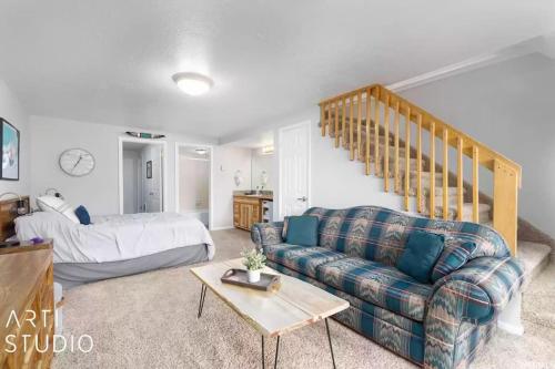 a living room with a couch and a bed at Perfect Mt. Location! Skiing, Hiking, Biking, Pool in Eden