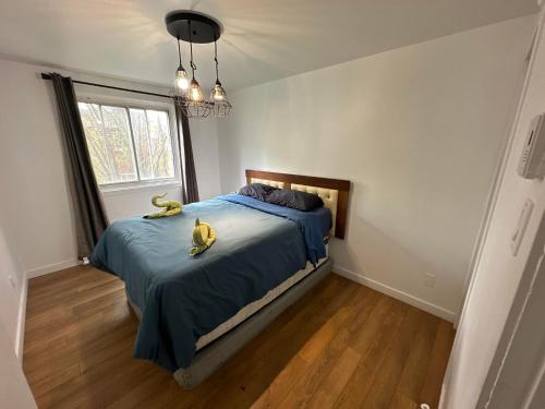 a bedroom with a bed with two bananas on it at Appartement une chambre - 576 in Montreal