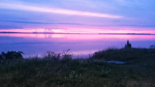 a view of a large body of water at sunset at Afecto in San Gregorio de Polanco