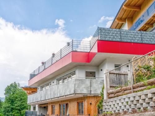 a house with a red and white facade at Josef in Helfenstein