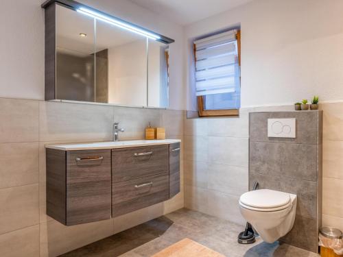 a bathroom with a toilet and a sink at Josef in Helfenstein