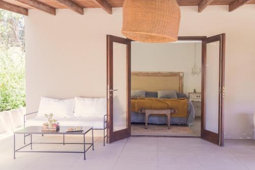 a bedroom with a bed and a mirror at Casa Shanti - La Barra in Punta del Este