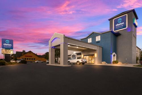 a dealership with a car in a parking lot at Clarion Pointe Sevierville-Pigeon Forge in Sevierville