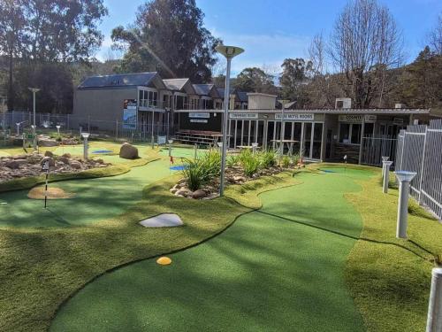 a putting green in front of a building at The Bright Motor Inn in Bright