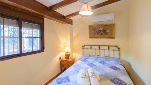 Ένα ή περισσότερα κρεβάτια σε δωμάτιο στο Marquise House con piscina privada