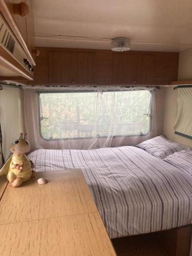 a bedroom with a bed in an rv at Home Shanti, relax tra i ciliegi in Crespellano