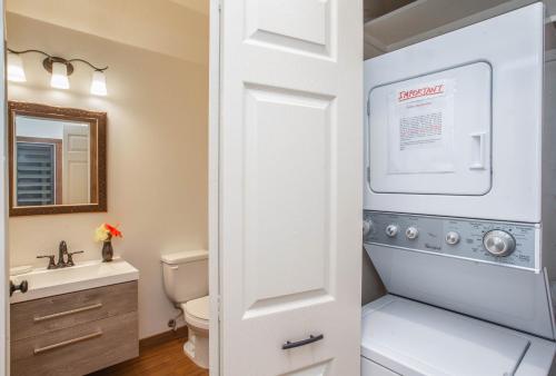 a bathroom with a toilet and a sink at Kaha Lani 304 in Lihue