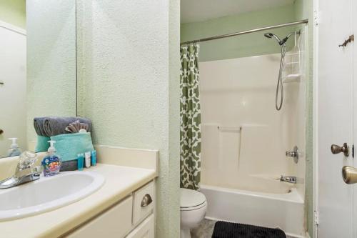 a bathroom with a sink and a toilet and a shower at Kimberly Villa in Panama City Beach
