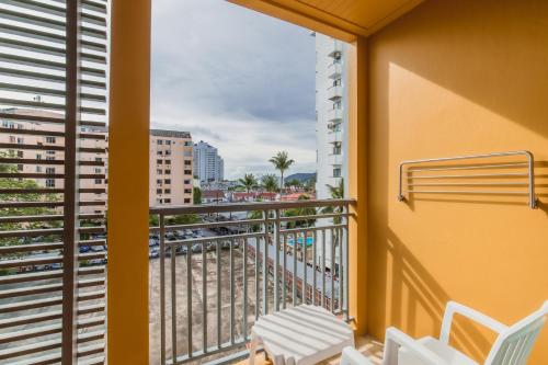 a balcony with a view of a city at Bauman Residence Patong, Phuket in Patong Beach