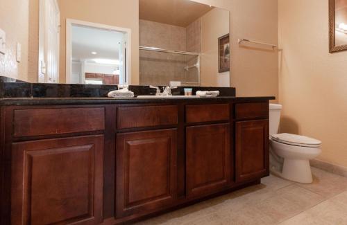 a bathroom with a sink and a toilet at 8000TW Unit 4403- Tuscana Resort in Kissimmee