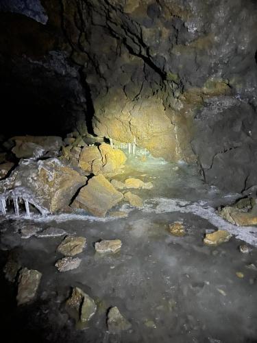 a cave filled with water and rocks at Alba Marina e Tramonti Etnei in Riposto