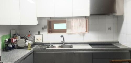 a kitchen with a sink and a counter top at Yire House in Seoul