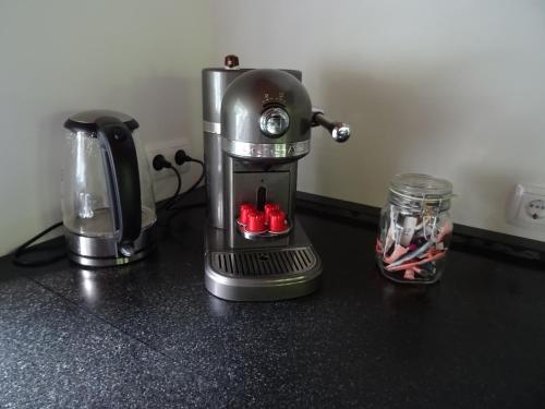 a coffee maker is sitting on a counter at Forest Villa, Kaatsheuvel in Loon op Zand