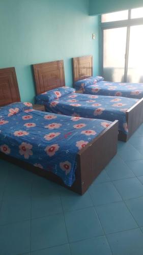 Łóżko lub łóżka w pokoju w obiekcie Elmosheer hotel