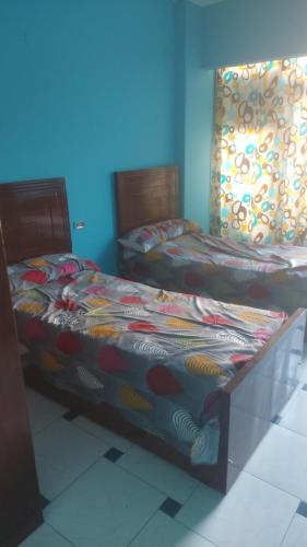 Кровать или кровати в номере Elmosheer hotel