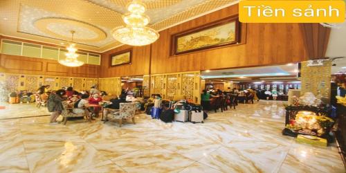 a lobby of a hotel with people sitting in chairs at Linh Phuong 8 Hotel - 24 hours stay in Can Tho