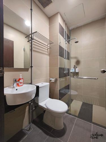 a bathroom with a toilet and a sink and a shower at D'Esplanande Residence Homestay by WELCOME HOME in Johor Bahru