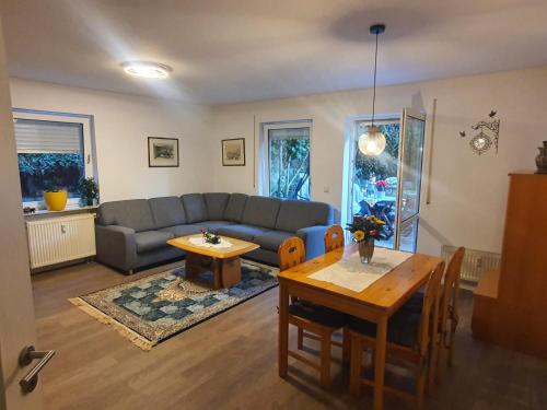 a living room with a couch and a table at Dennis Apartment in Dresden