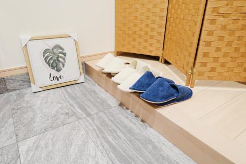 a group of shoes sitting on a counter in a room at Sumiyoshi Marie - Vacation STAY 12160 in Osaka