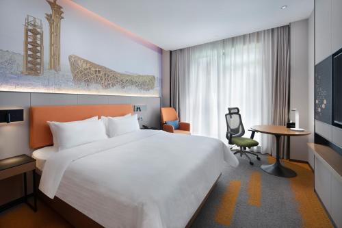 Uma cama ou camas num quarto em Hampton by Hilton Beijing South Railway Station