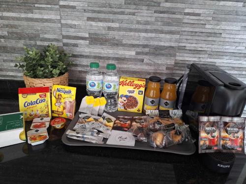 a tray of food and drinks on a table at Primera Linea del Mar - Acceso Directo Playa Carihuela in Torremolinos