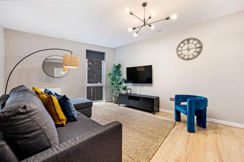 a living room with a couch and a tv at Host & Stay - Ropewalks Quarters in Liverpool