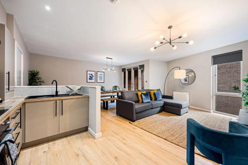 a kitchen and living room with a couch and a table at Host & Stay - Ropewalks Quarters in Liverpool