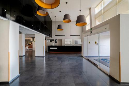 a lobby with a pool in the middle of a building at City Express by Marriott Salina Cruz in Salina Cruz