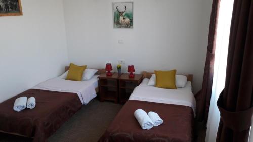 Łóżko lub łóżka w pokoju w obiekcie Garni hotel Niksic