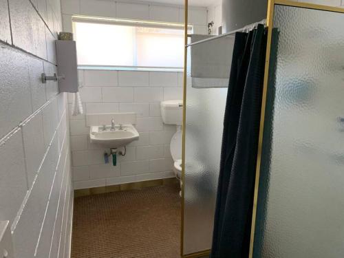 a bathroom with a toilet and a sink at Harbour View 49 Urch Street Unit 2 in Geraldton