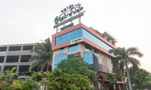 a building with a sign on top of it at Treebo Trend Bhairavee in Pune