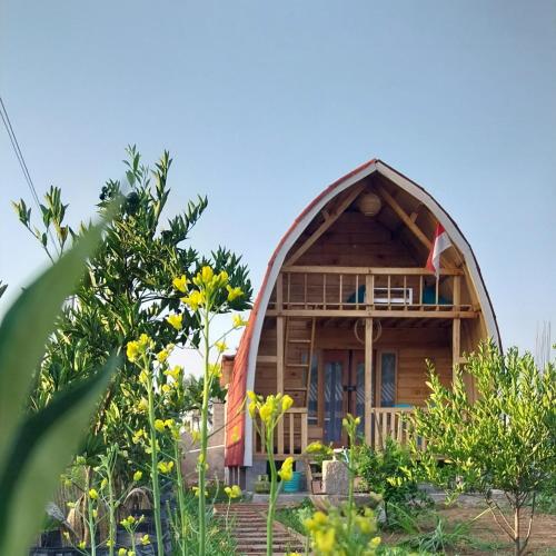 a small house with a round roof at Raturinjani homestay in Selong