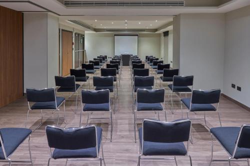 a row of chairs in a waiting room at City Express by Marriott Guaymas in Guaymas